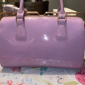 This beautiful lilac color handbag brand new